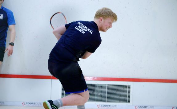 Coach delivering squash